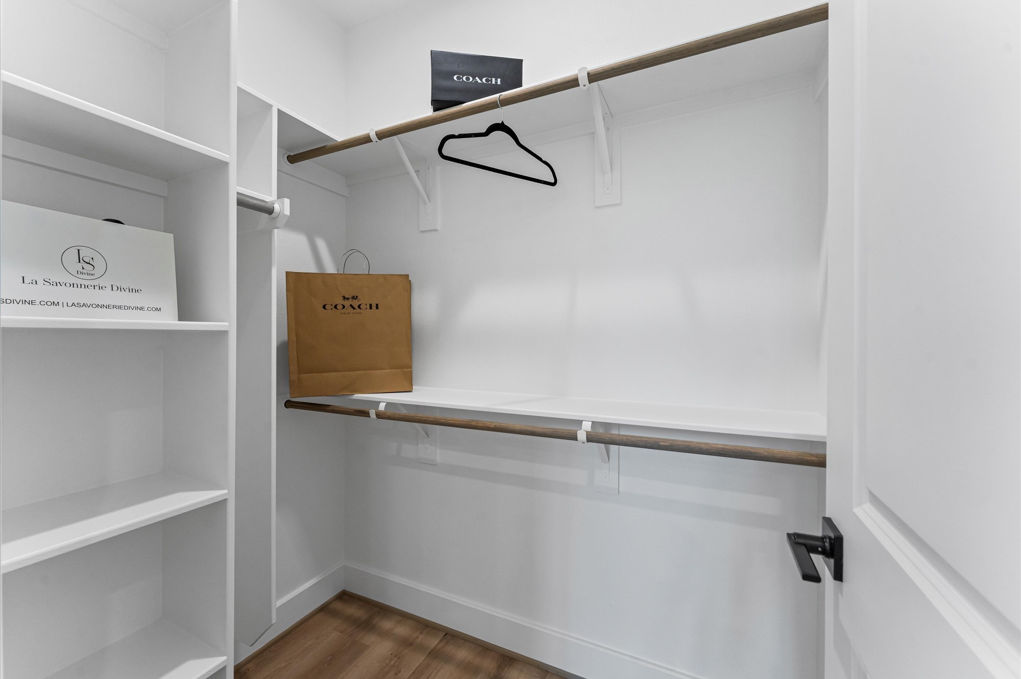 1122 West 17th Street, Unit E Houston, TX 77008 - Photo 27 of 37 a view of a room with racks on the wall