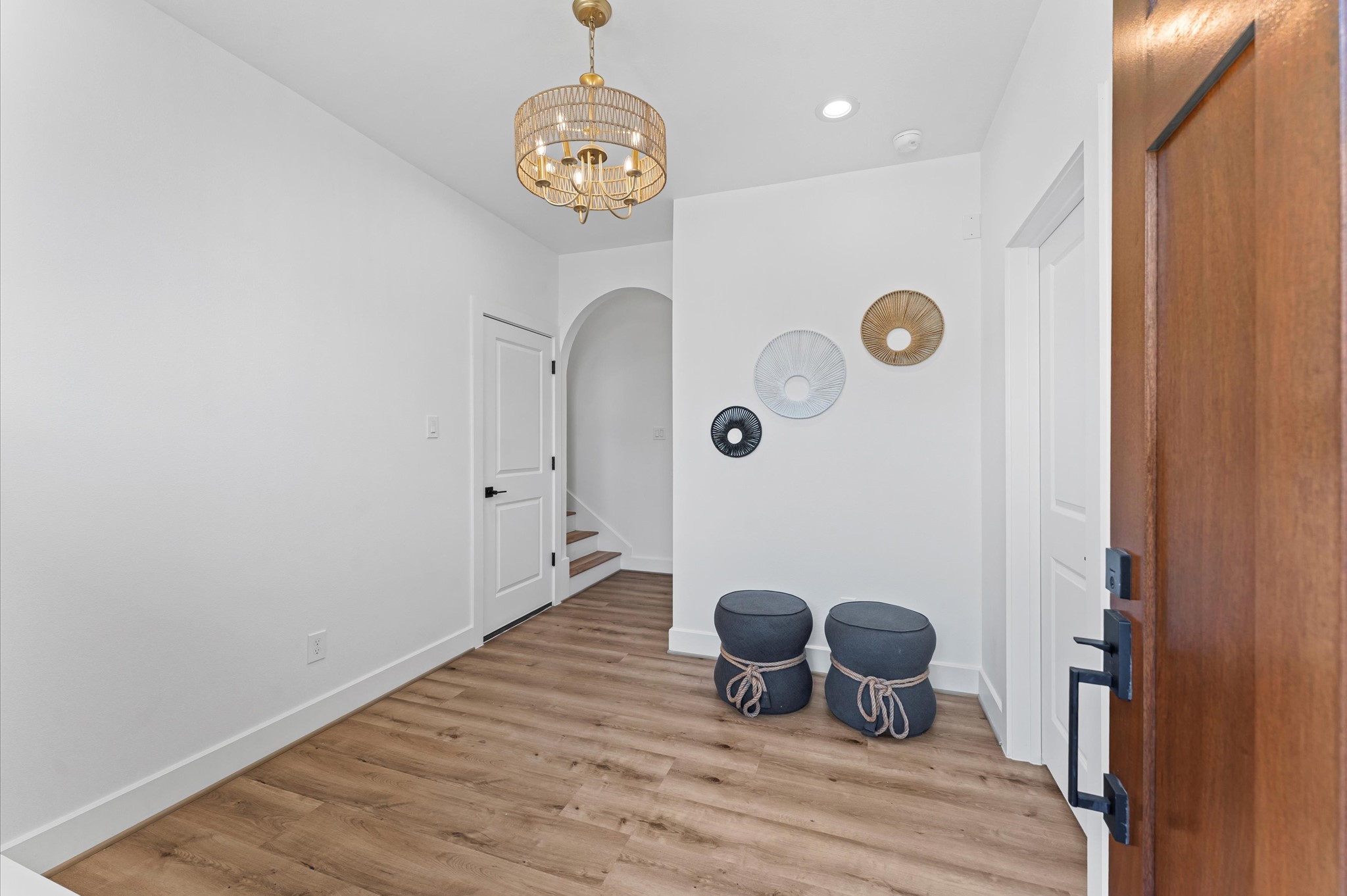 1122 West 17th Street, Unit E Houston, TX 77008 - Photo 3 of 37 a view of a storage and utility room with wooden floor