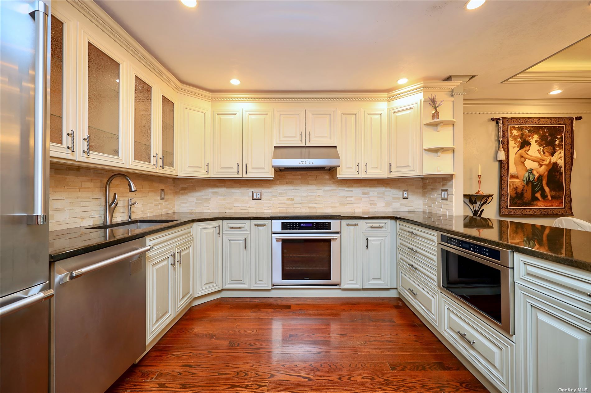 99 Clent Road, Unit 103 Great Neck, NY 11021 - Photo 1 of 1 a kitchen with stainless steel appliances granite countertop a stove and a sink
