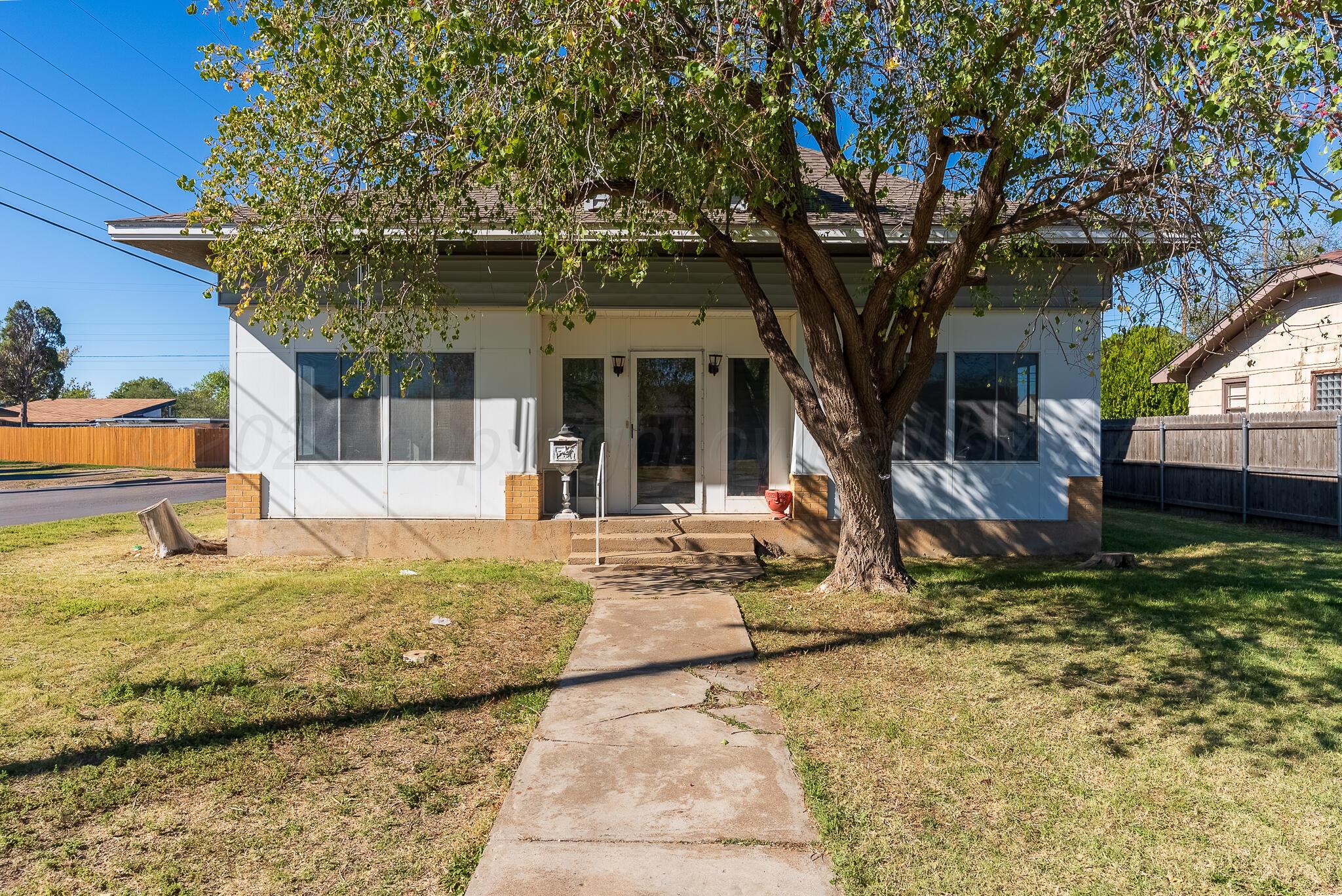 4124 Crockett Street Amarillo, TX 79110 - Photo 1 of 25 a view of a house with backyard porch and sitting area