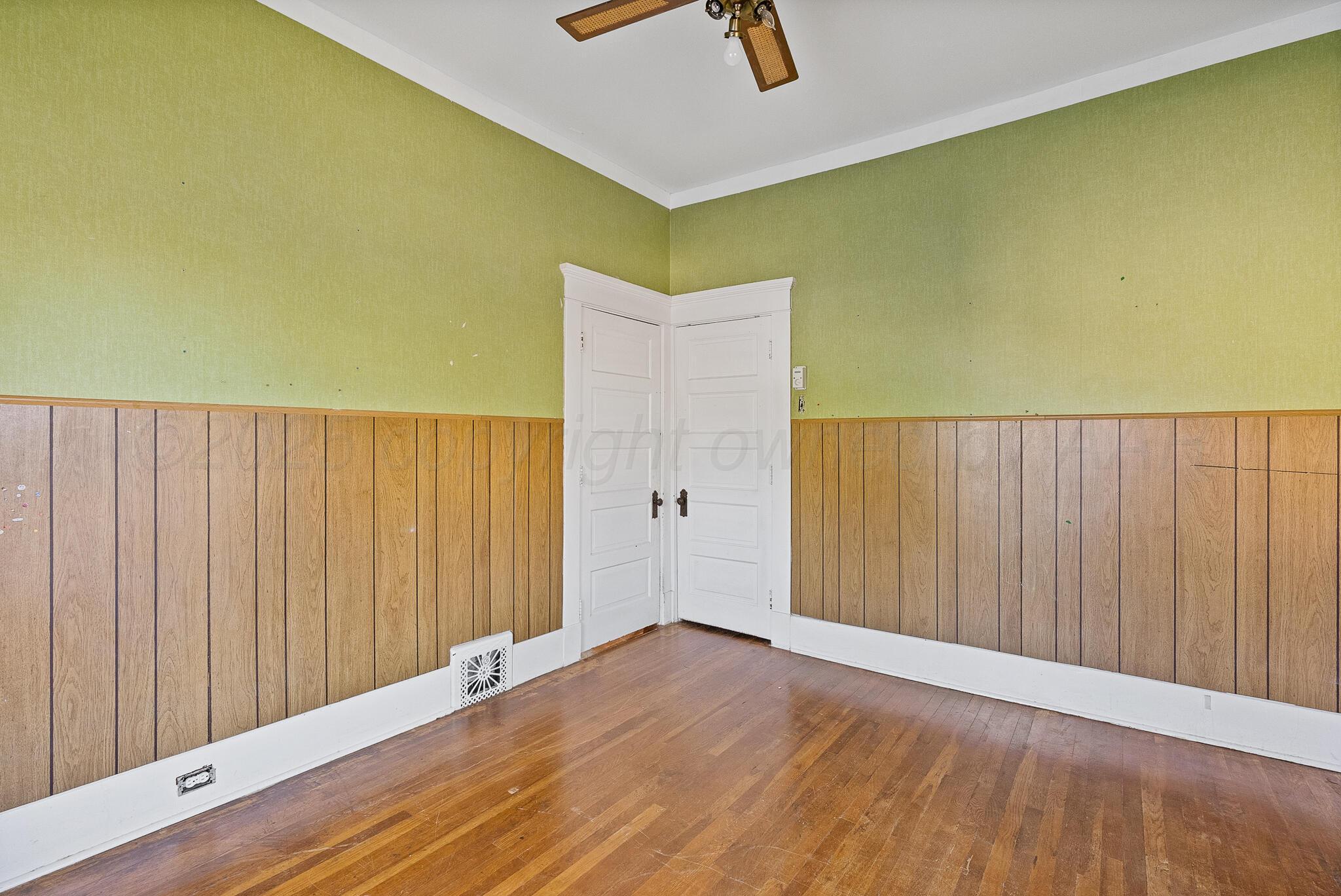 4124 Crockett Street Amarillo, TX 79110 - Photo 14 of 25 a view of a room with wooden floor