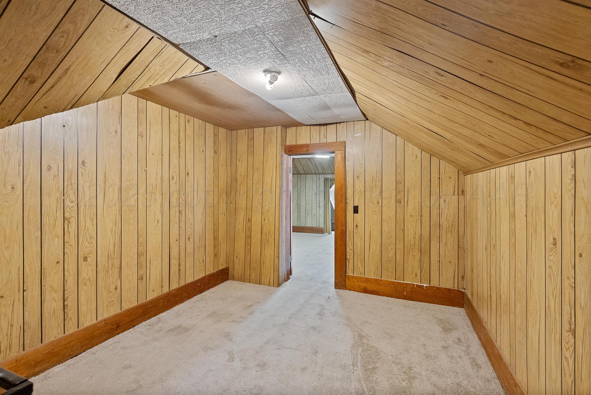 4124 Crockett Street Amarillo, TX 79110 - Photo 16 of 25 a view of a room with wooden walls
