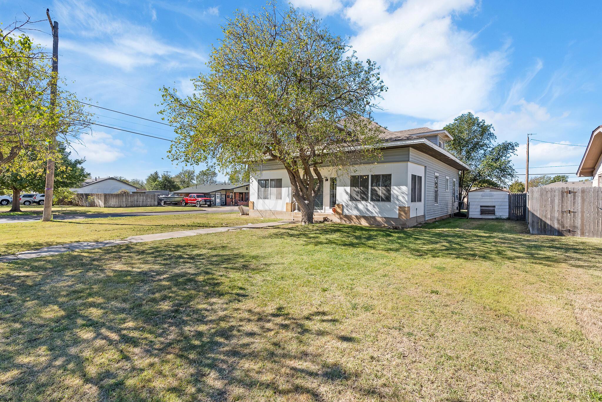 4124 Crockett Street Amarillo, TX 79110 - Photo 2 of 25 a view of a house with a swimming pool