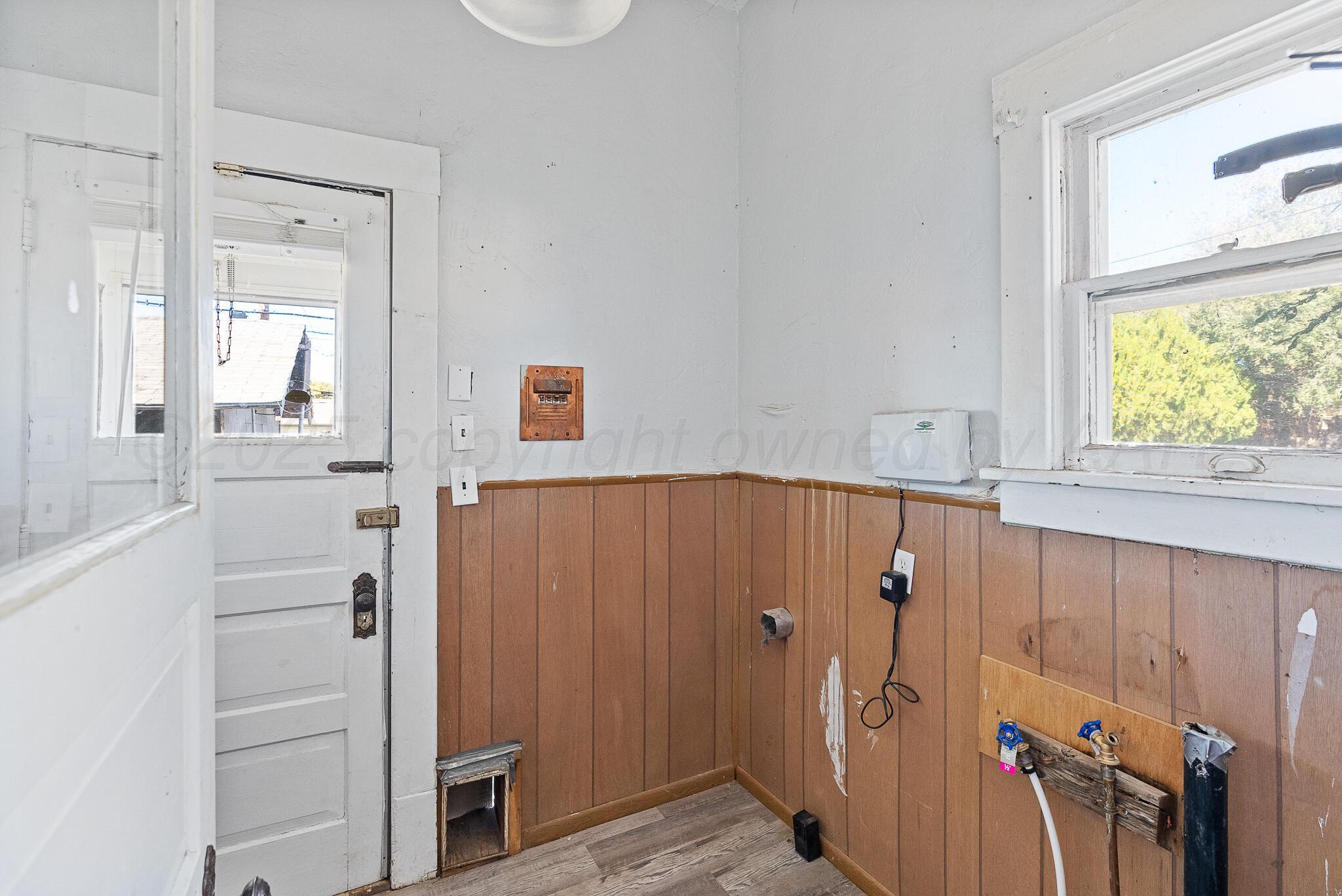 4124 Crockett Street Amarillo, TX 79110 - Photo 22 of 25 a view of a hallway and wooden shelves
