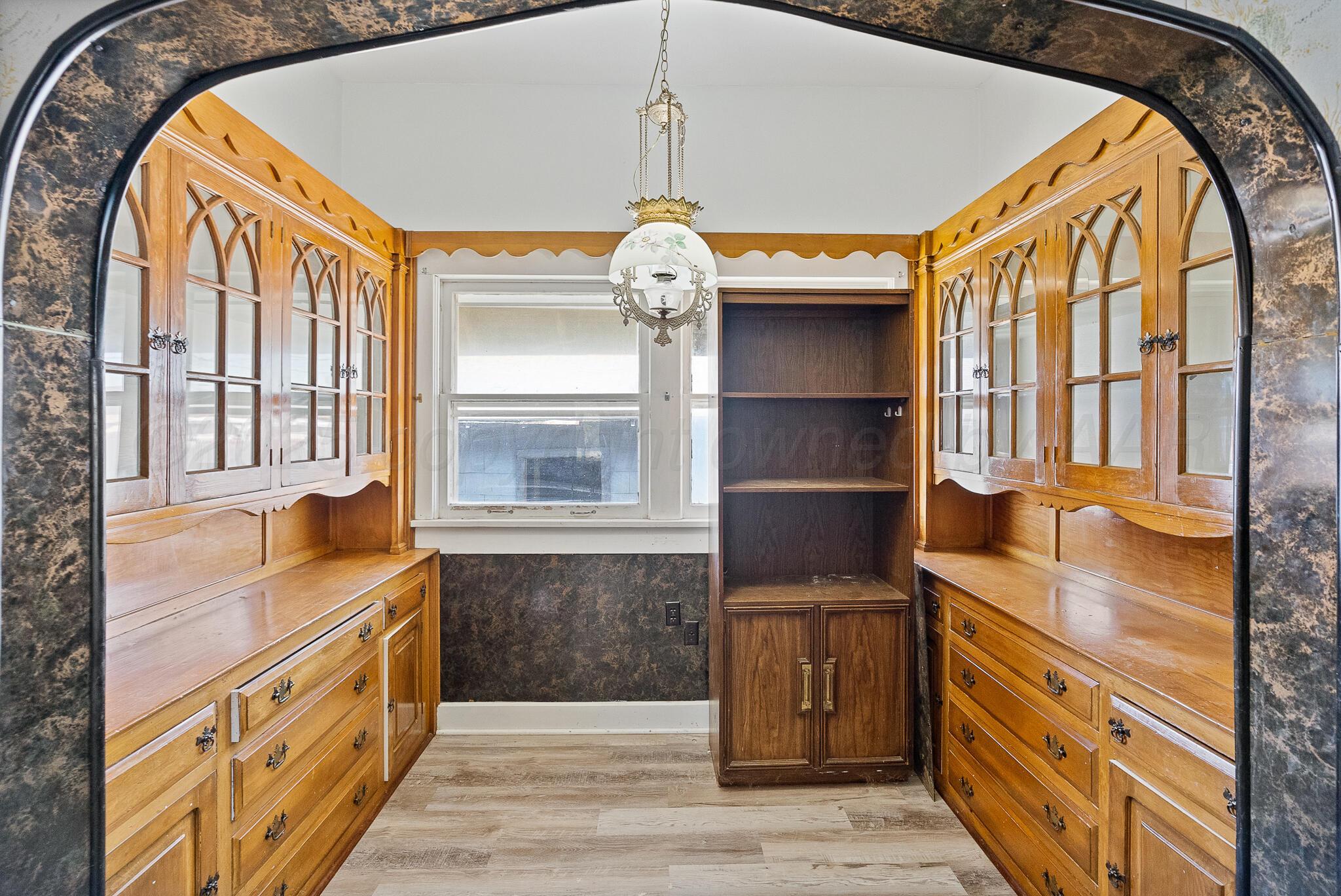 4124 Crockett Street Amarillo, TX 79110 - Photo 10 of 25 a bathroom with a double vanity sink and a mirror