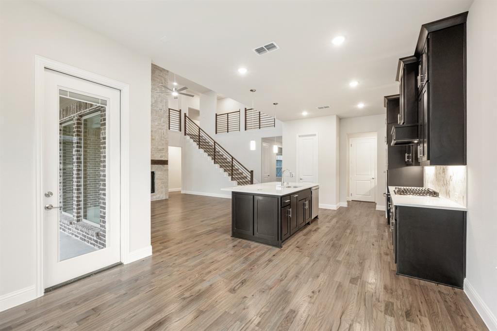 1113 Cardinal Drive Midlothian, TX 76065 - Photo 13 of 34 a view of kitchen with wooden floor and electronic appliances