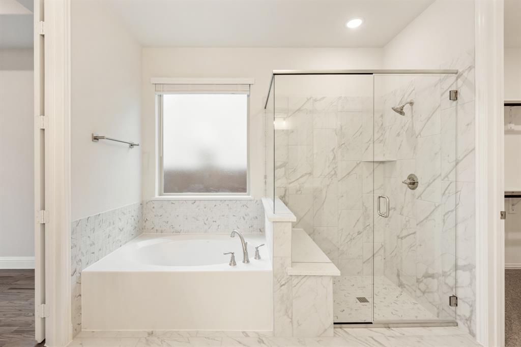 1113 Cardinal Drive Midlothian, TX 76065 - Photo 17 of 34 a bathroom with a bathtub and a shower