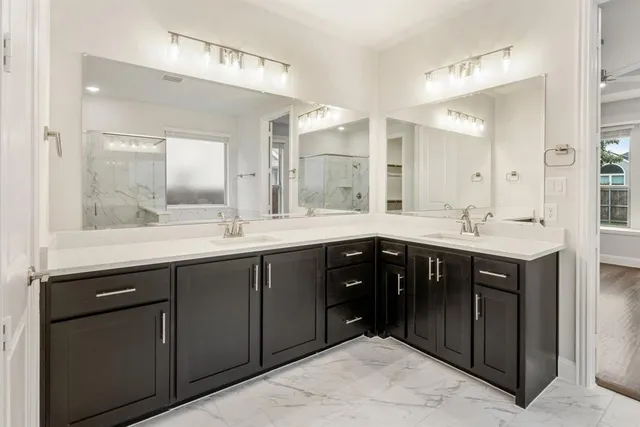 a bathroom with a sink vanity and a mirror