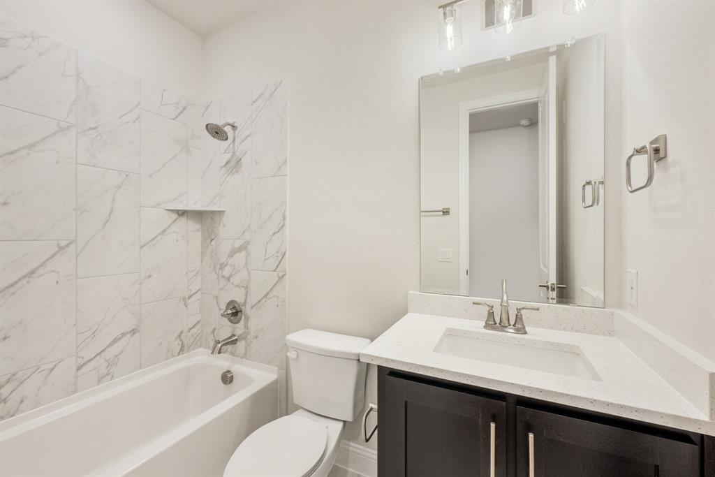 1113 Cardinal Drive Midlothian, TX 76065 - Photo 20 of 34 a bathroom with a sink toilet tub and shower