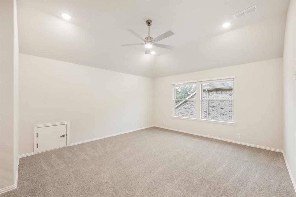 1113 Cardinal Drive Midlothian, TX 76065 - Photo 22 of 34 an empty room with windows and fan