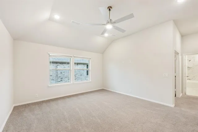 an empty room with a empty space and a ceiling fan