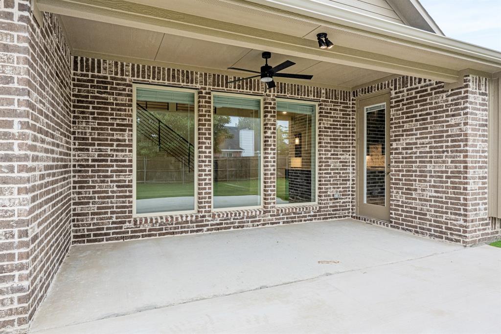 1113 Cardinal Drive Midlothian, TX 76065 - Photo 31 of 34 a view of a house with a large window