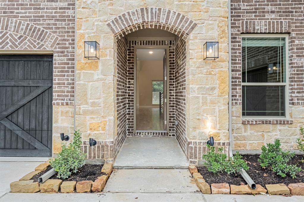 1113 Cardinal Drive Midlothian, TX 76065 - Photo 4 of 34 a view of front door of house with potted plants