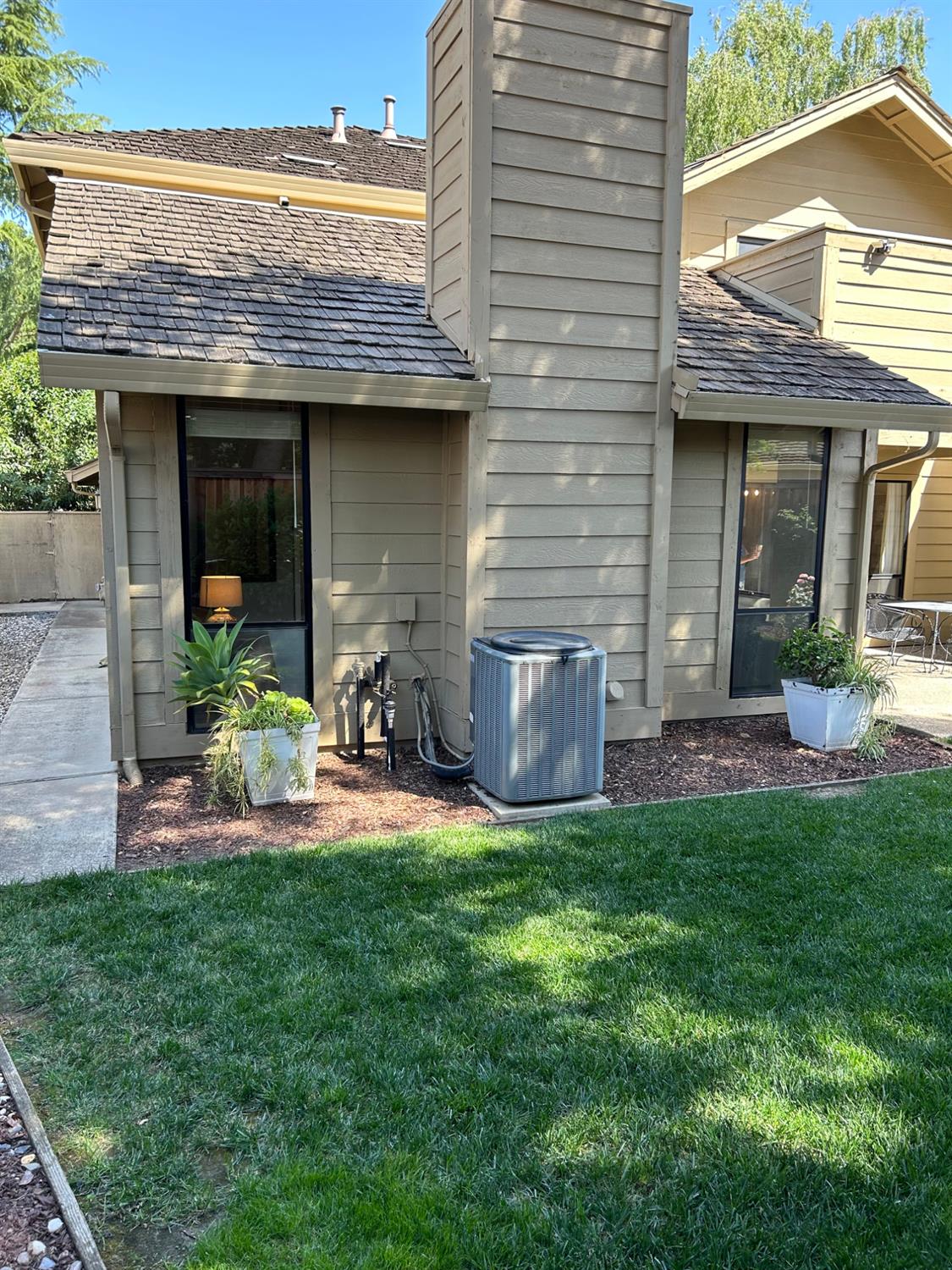 1067 Rio Cidade Way Sacramento, CA 95831 - Photo 25 of 33 a view of a house with a backyard and a patio