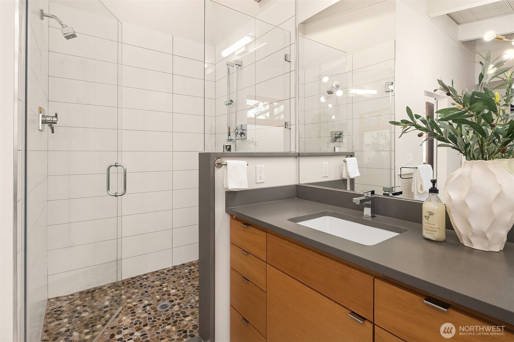 2826 Southwest 170th Street Burien, WA 98166 - Photo 22 of 40 a bathroom with a granite countertop sink a mirror and shower