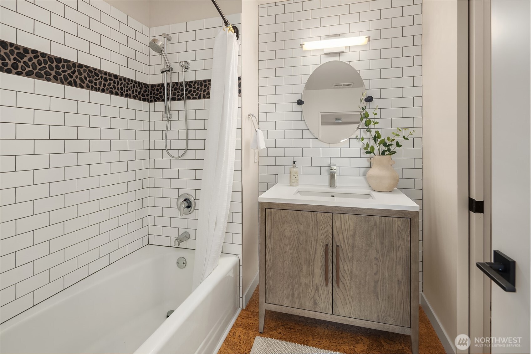 2826 Southwest 170th Street Burien, WA 98166 - Photo 28 of 40 a bathroom with a sink a mirror and a bathtub