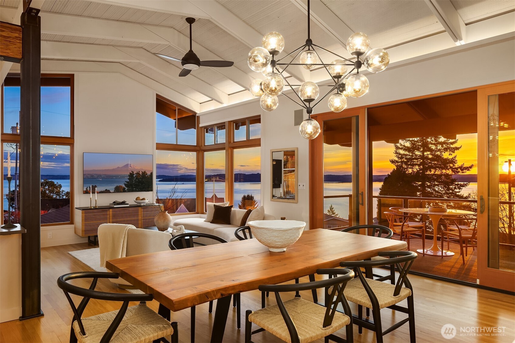 2826 Southwest 170th Street Burien, WA 98166 - Photo 10 of 40 a view of a dining room with furniture a chandelier and large windows