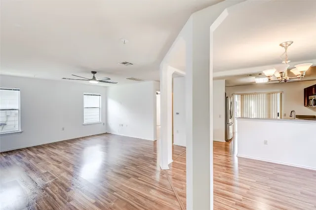 a view of a livingroom with wooden floor