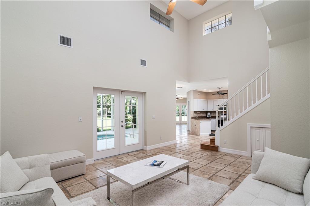 4049 Skyway Drive Naples, FL 34112 - Photo 13 of 31 a living room with furniture and a window