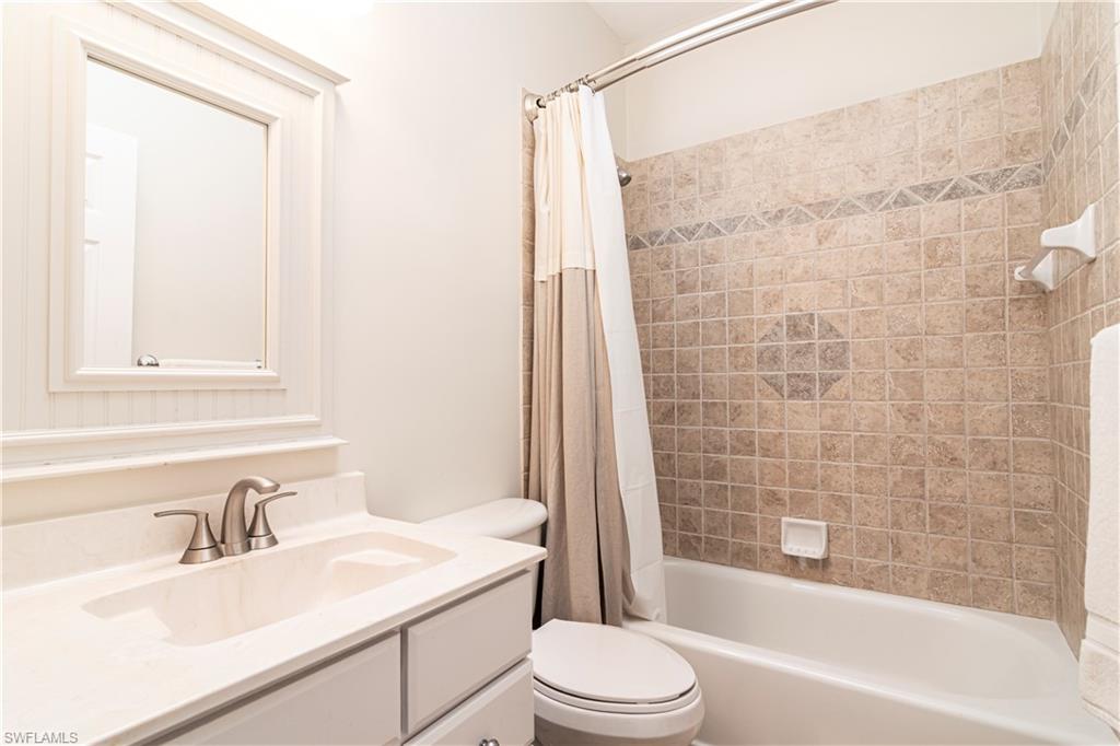 4049 Skyway Drive Naples, FL 34112 - Photo 17 of 31 a bathroom with a sink toilet and shower