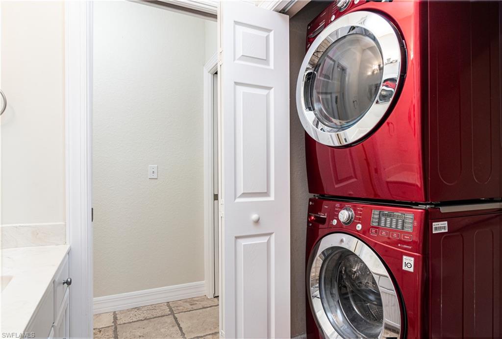 4049 Skyway Drive Naples, FL 34112 - Photo 18 of 31 a view of a storage and utility room with washer and dryer