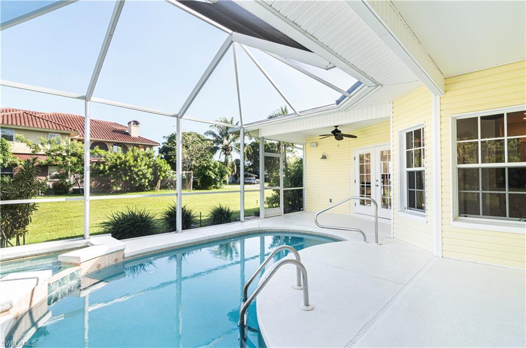 4049 Skyway Drive Naples, FL 34112 - Photo 23 of 31 a view of a house with a swimming pool
