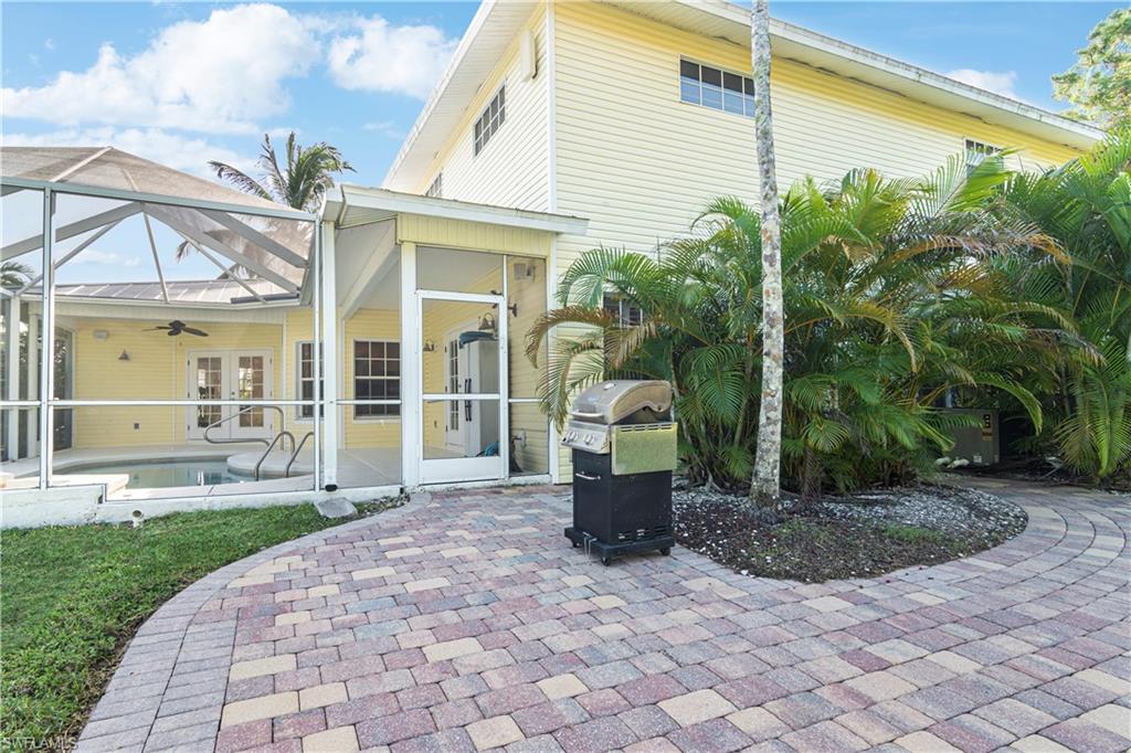 4049 Skyway Drive Naples, FL 34112 - Photo 24 of 31 a view of a house with backyard and sitting area