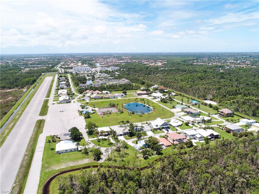 4049 Skyway Drive Naples, FL 34112 - Photo 26 of 31 an aerial view of residential houses with outdoor space