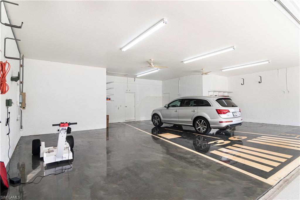 4049 Skyway Drive Naples, FL 34112 - Photo 27 of 31 a white car parked in a garage