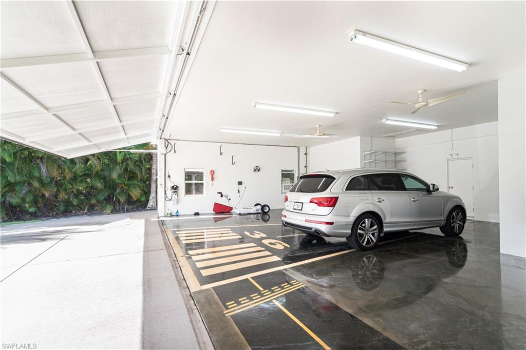 4049 Skyway Drive Naples, FL 34112 - Photo 28 of 31 a view of parking area and car parked