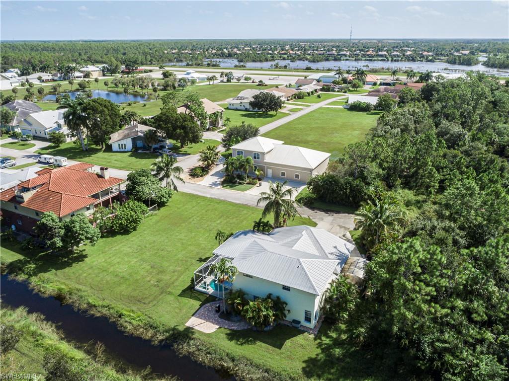 4049 Skyway Drive Naples, FL 34112 - Photo 30 of 31 an aerial view of a house with a yard