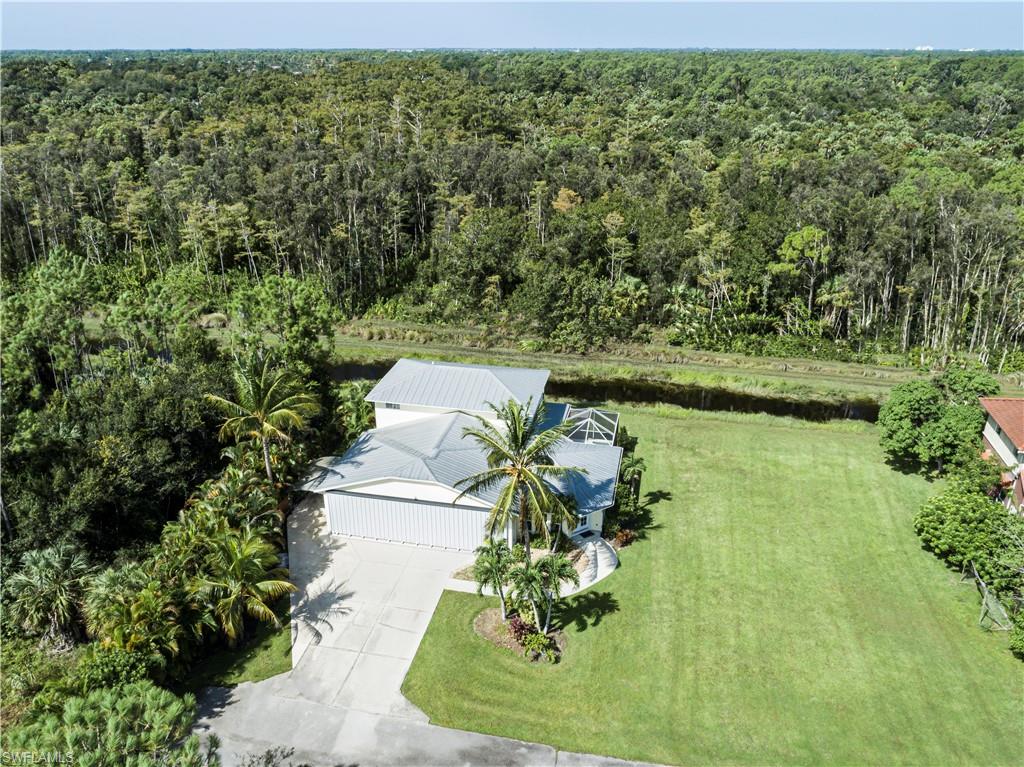 4049 Skyway Drive Naples, FL 34112 - Photo 31 of 31 a picture of a yard with a lake view