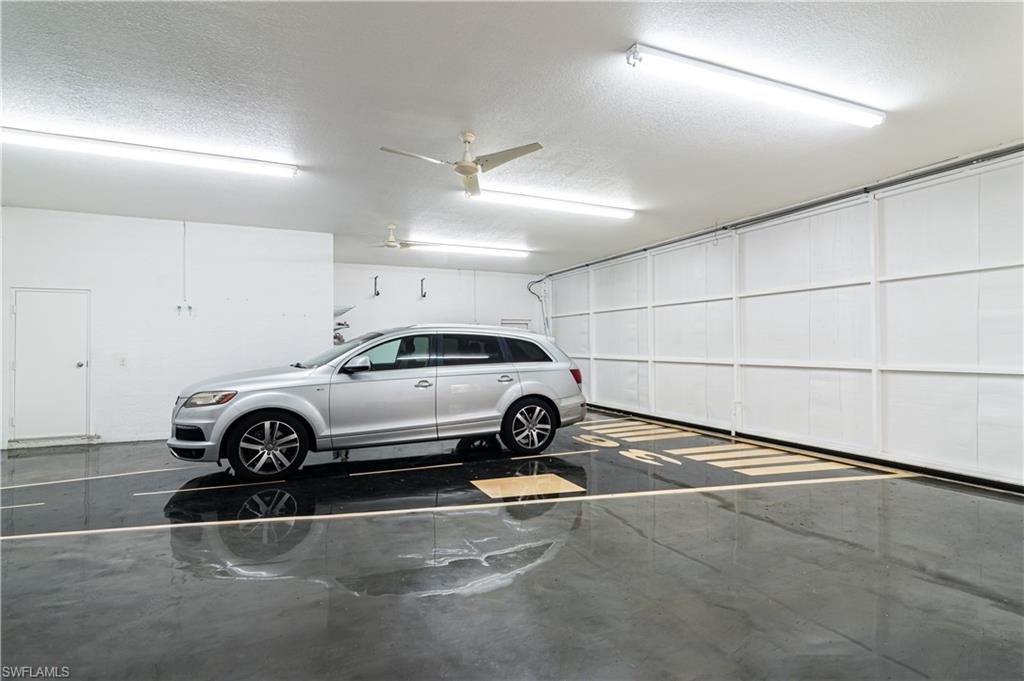 4049 Skyway Drive Naples, FL 34112 - Photo 5 of 31 a car parked in a garage