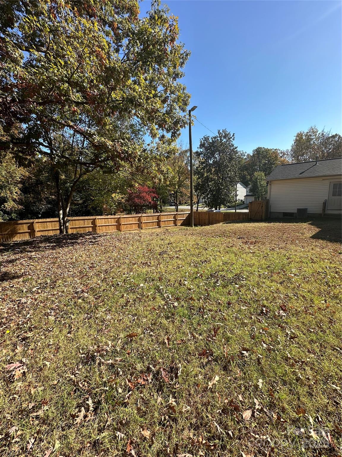 1215 Summerville Road, Unit 112 Charlotte, NC 28214 - Photo 19 of 20 a view of a yard with trees