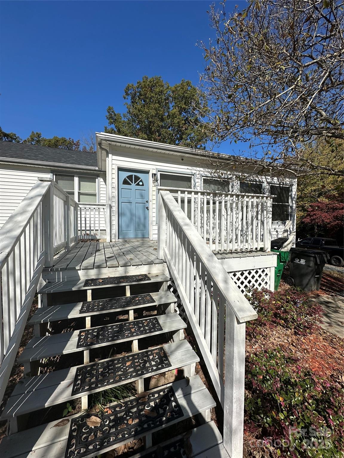 1215 Summerville Road, Unit 112 Charlotte, NC 28214 - Photo 3 of 20 a view of a balcony with wooden floor and fence