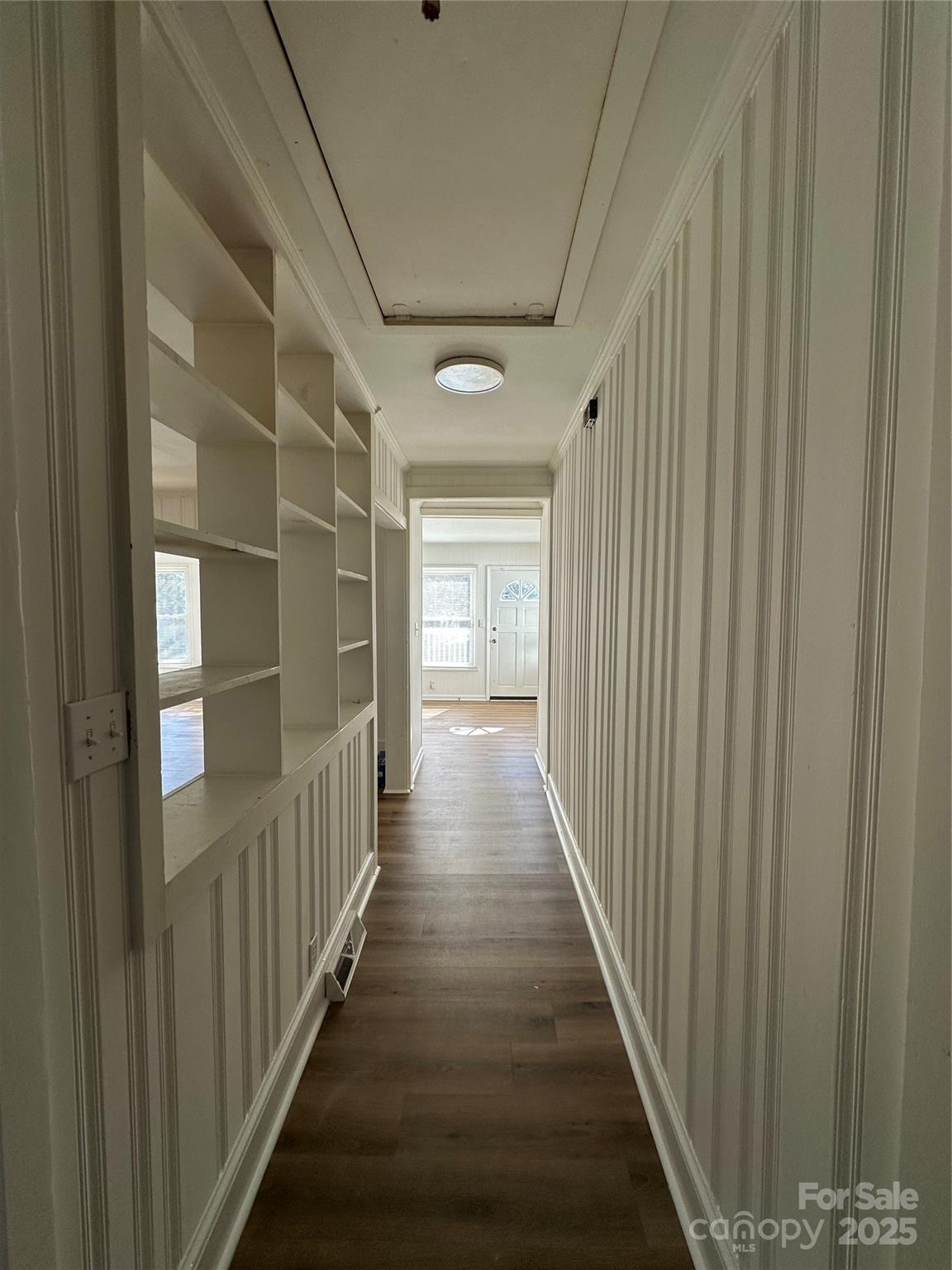 1215 Summerville Road, Unit 112 Charlotte, NC 28214 - Photo 5 of 20 a view of a hallway with wooden floor and staircase