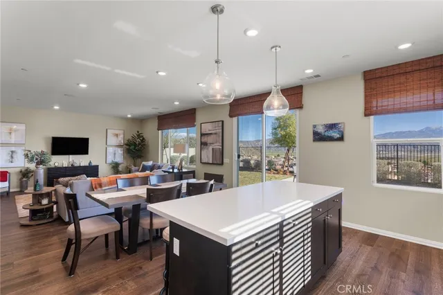 a large kitchen with a table and chairs