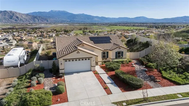 an aerial view of a house with a garden