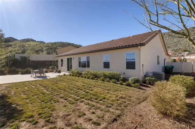 a house view with a outdoor space