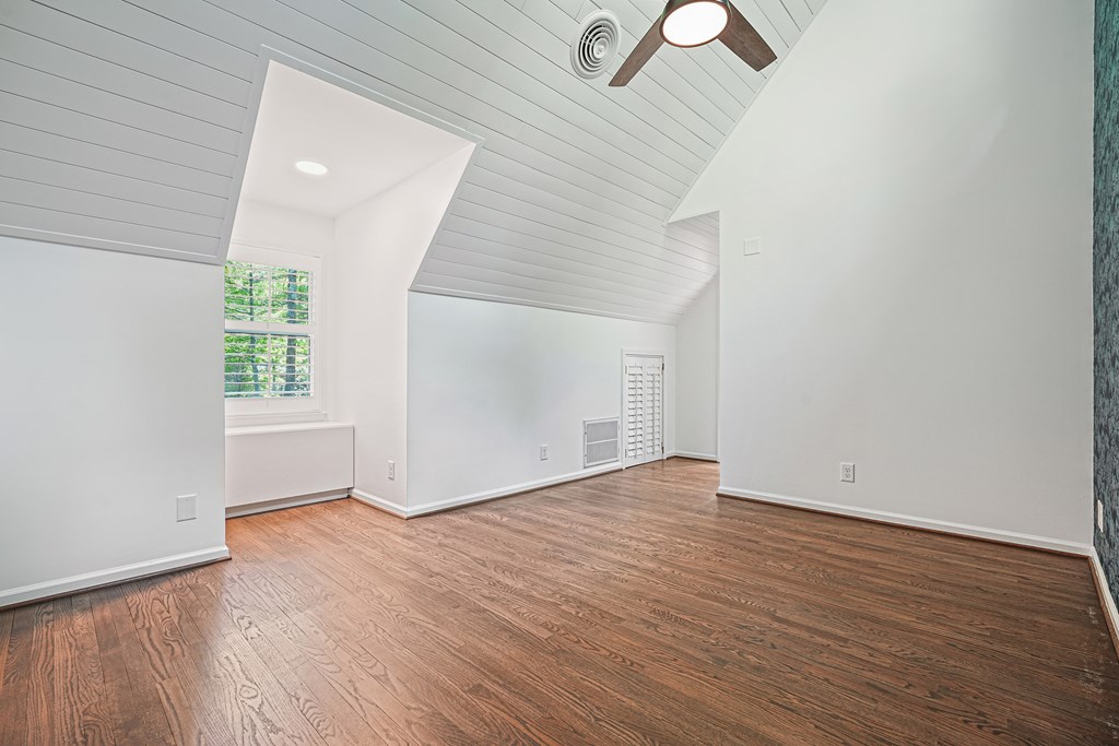 230 Chestnut Rise Trail Big Canoe, GA 30143 - Photo 23 of 45 an empty room with wooden floor cabinet and windows
