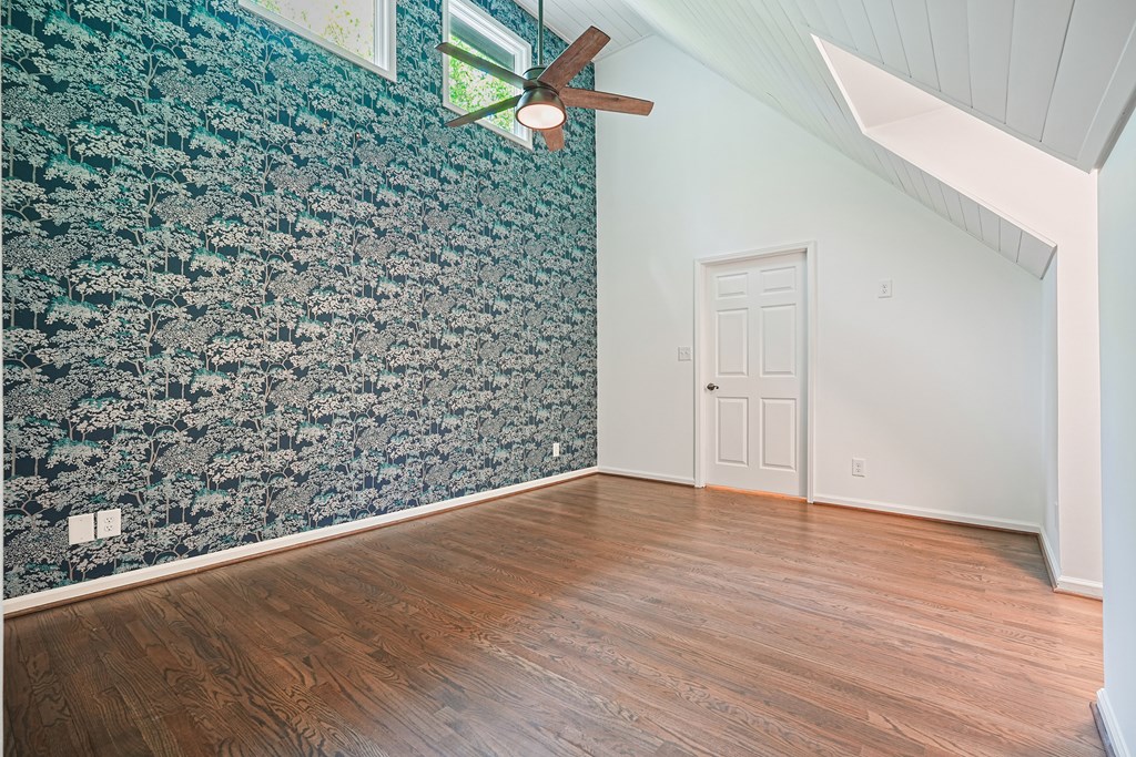 230 Chestnut Rise Trail Big Canoe, GA 30143 - Photo 24 of 45 a view of an empty room with wooden floor and a ceiling fan