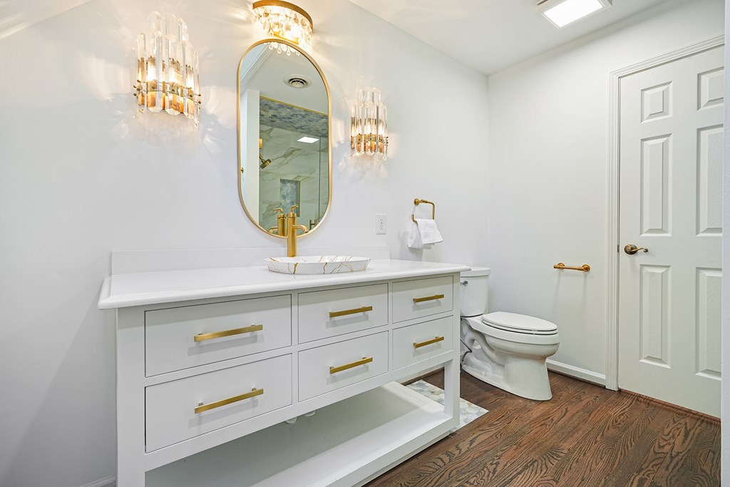 230 Chestnut Rise Trail Big Canoe, GA 30143 - Photo 25 of 45 a bathroom with a toilet a sink and mirror