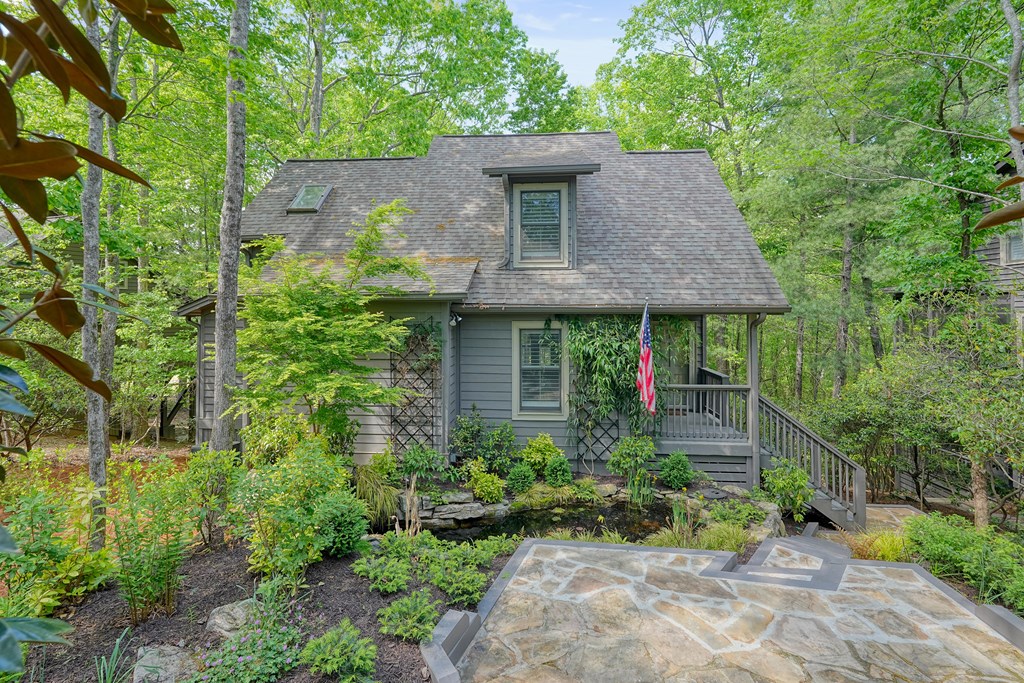 230 Chestnut Rise Trail Big Canoe, GA 30143 - Photo 3 of 45 a view of a house with a yard plants and large tree