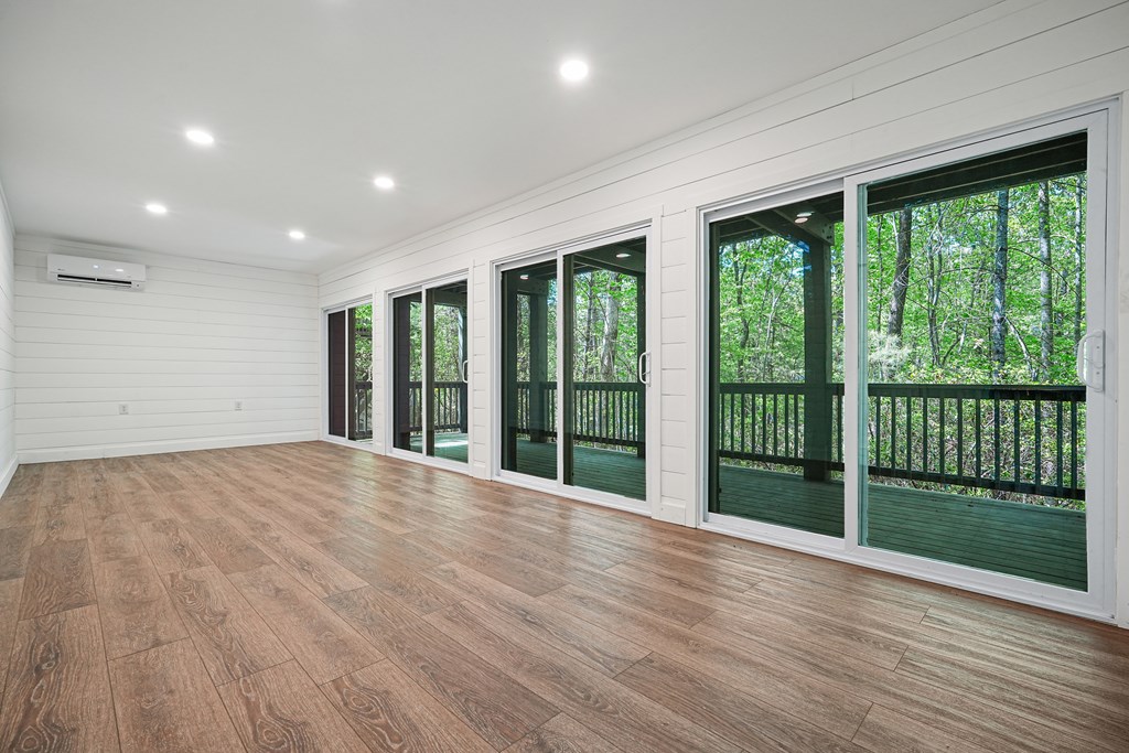 230 Chestnut Rise Trail Big Canoe, GA 30143 - Photo 31 of 45 a view of an empty room with wooden floor and a window