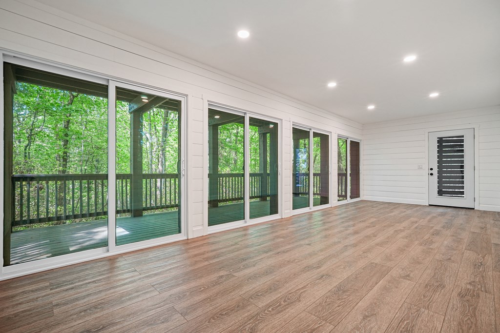 230 Chestnut Rise Trail Big Canoe, GA 30143 - Photo 32 of 45 a view of an empty room with wooden floor and a window