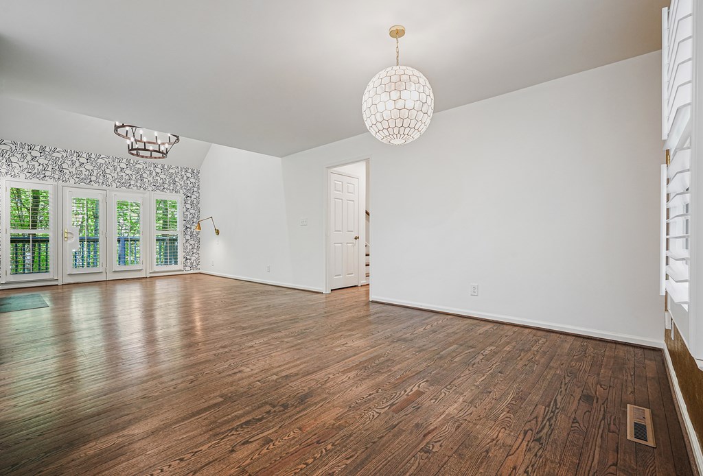 230 Chestnut Rise Trail Big Canoe, GA 30143 - Photo 7 of 45 an empty room with wooden floor and windows