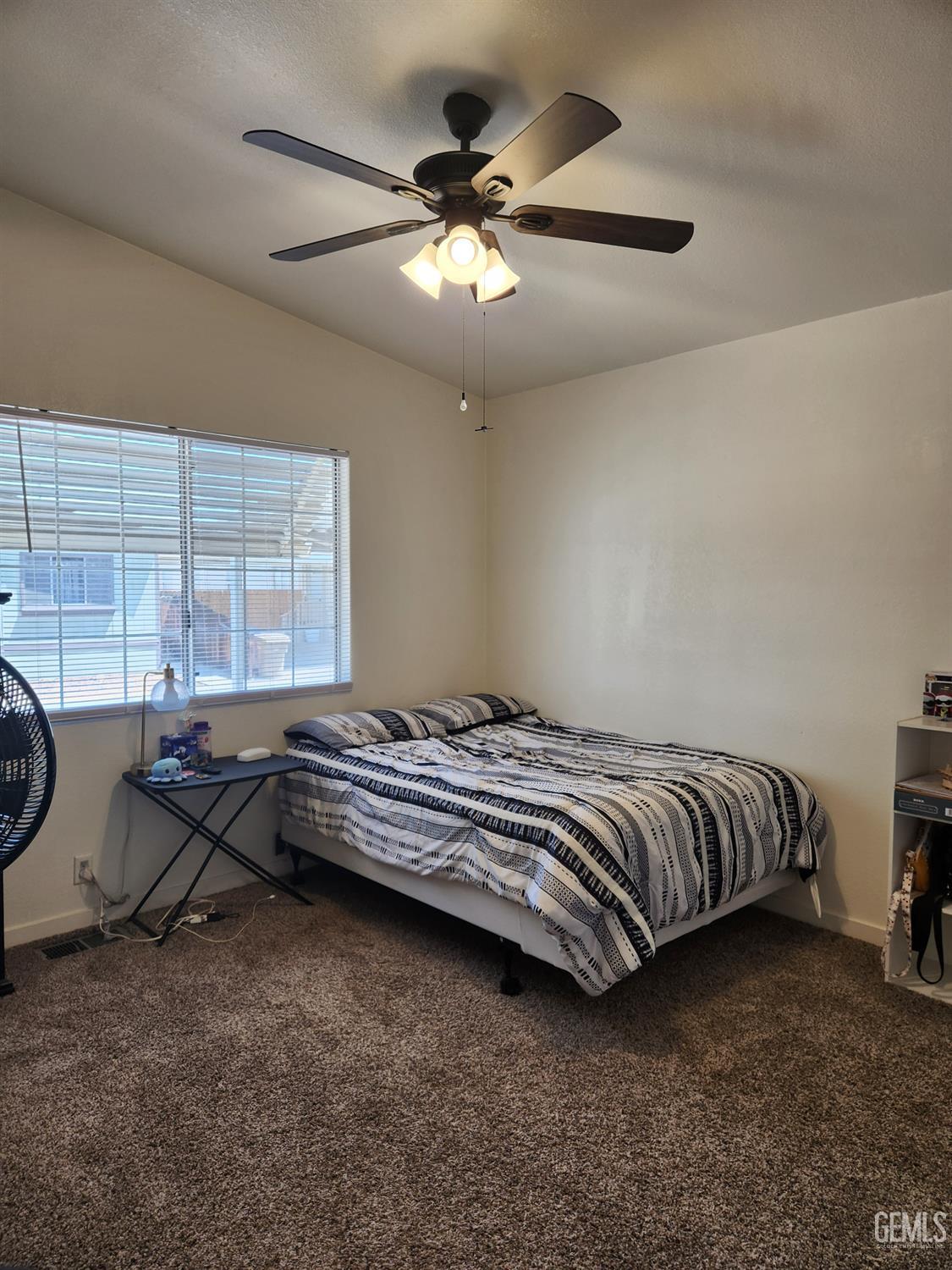 Undisclosed Address Bakersfield, CA 93314 - Photo 20 of 28 a bed sitting in a room next to a window