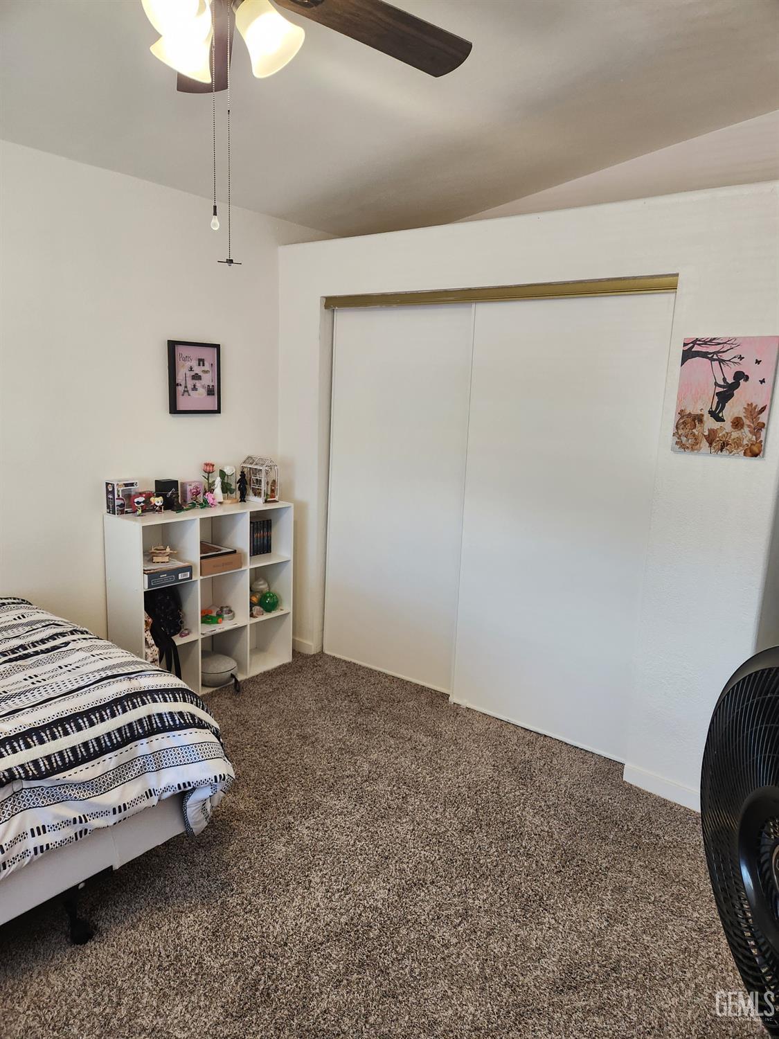 Undisclosed Address Bakersfield, CA 93314 - Photo 21 of 28 a bedroom with a bed and a chair in it