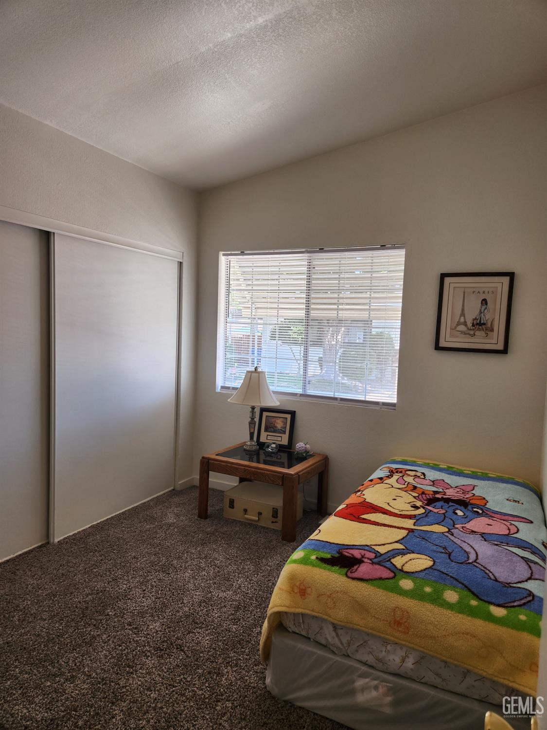Undisclosed Address Bakersfield, CA 93314 - Photo 22 of 28 a bedroom with a bed and a window