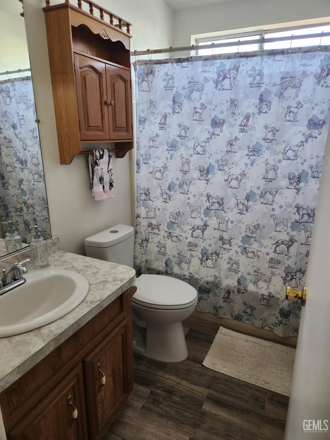 Undisclosed Address Bakersfield, CA 93314 - Photo 23 of 28 a bathroom with a granite countertop toilet and a sink